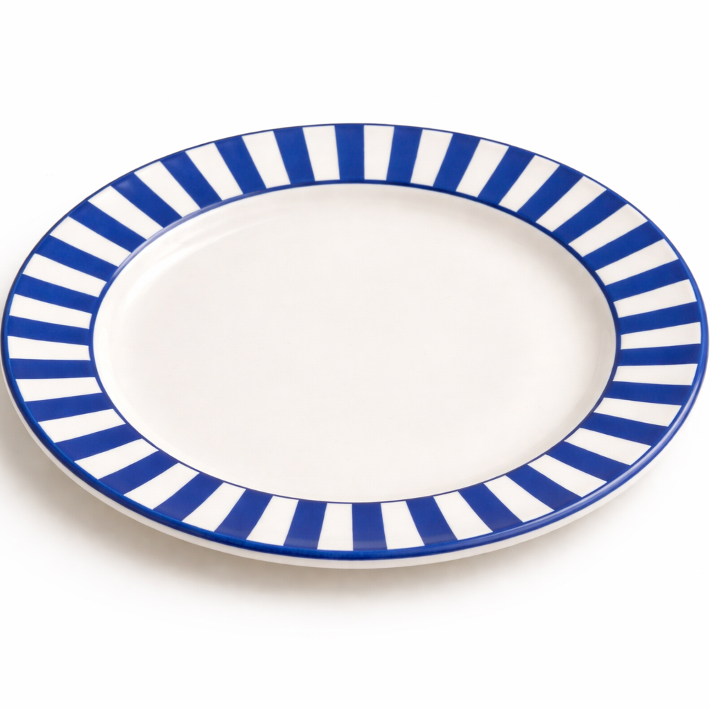 White plate with blue and white striped rim on a white background