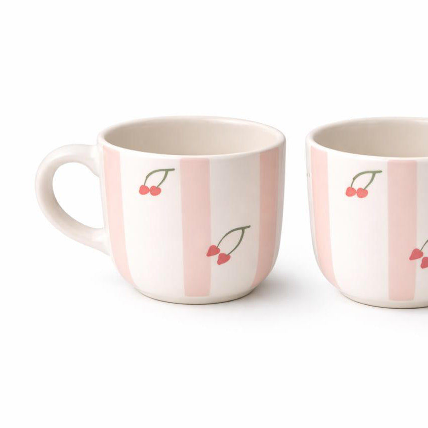 Two ceramic mugs with cherry design on a white background