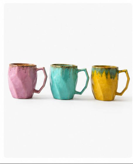 Set of colorful mugs with different designs on a white background
