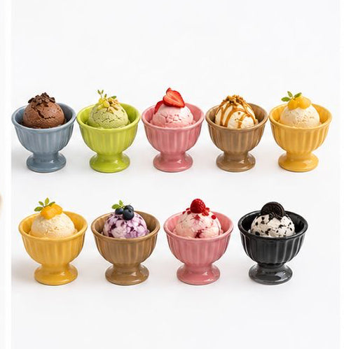 Set of small ceramic cups and saucers with various designs on a white background.