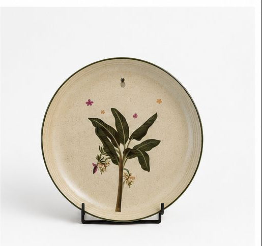 Set of ceramic dishes with botanical designs on a white background