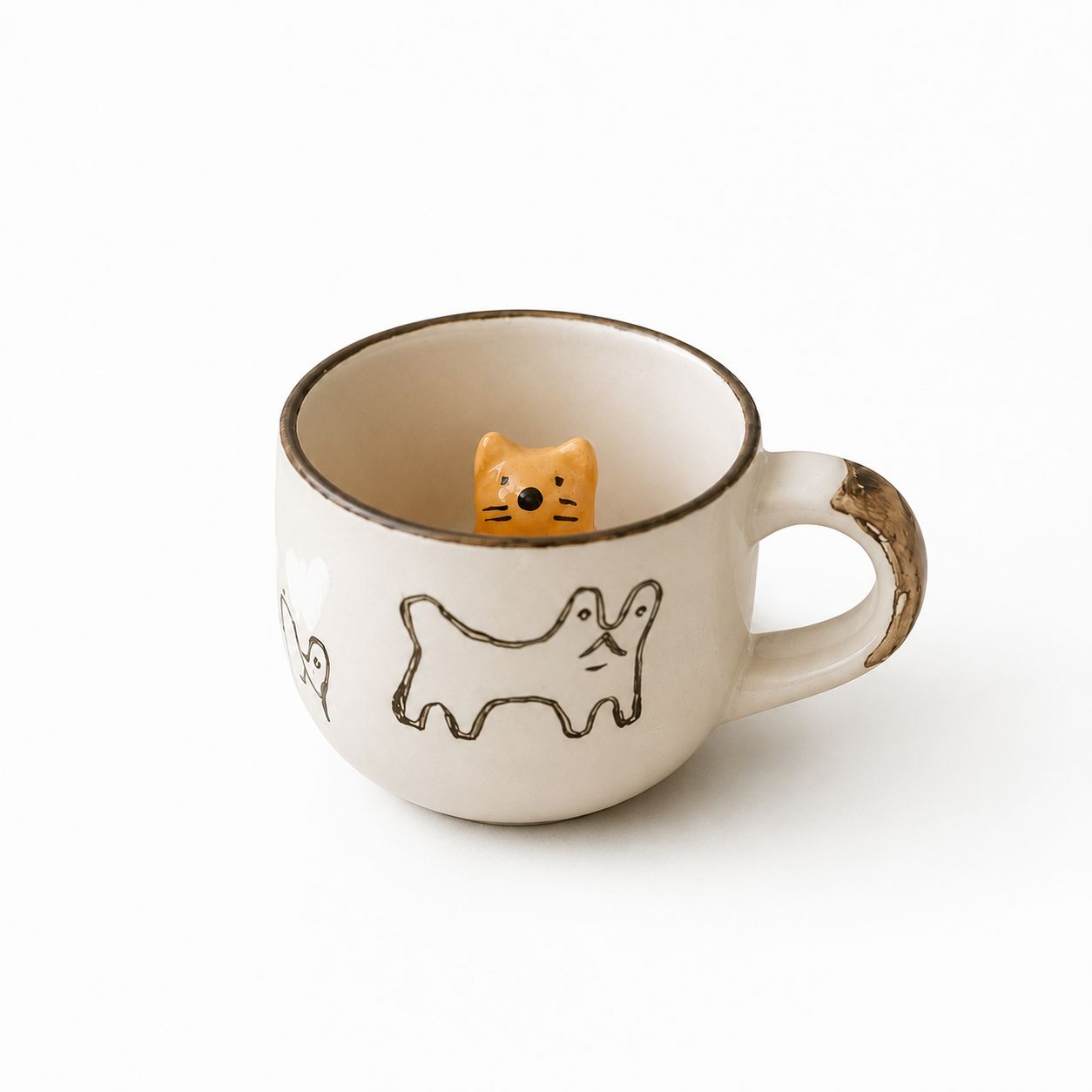 Ceramic mug with dog illustrations and a small dog-shaped figure inside on a white background