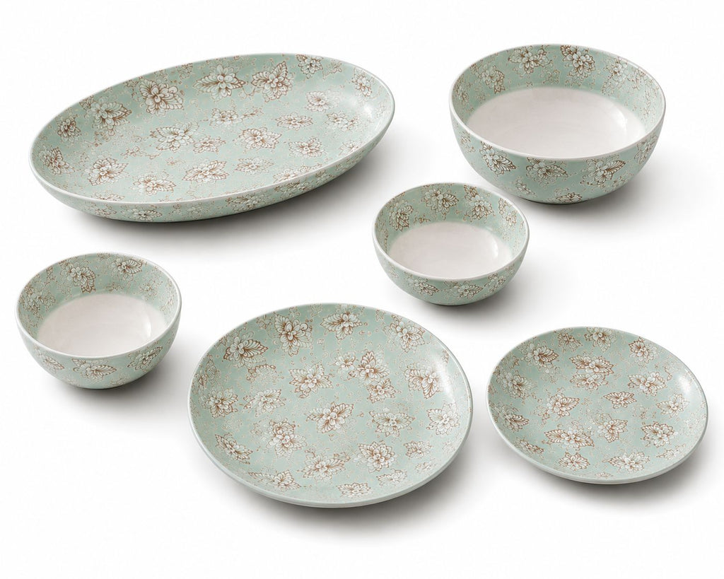 Set of ceramic dishes with floral pattern on a white background