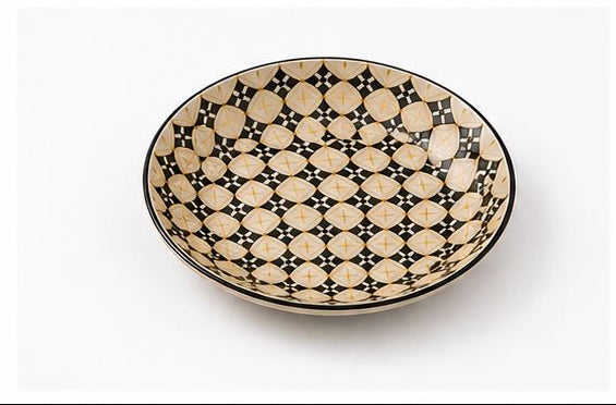 Set of ceramic bowls with geometric pattern on a white background