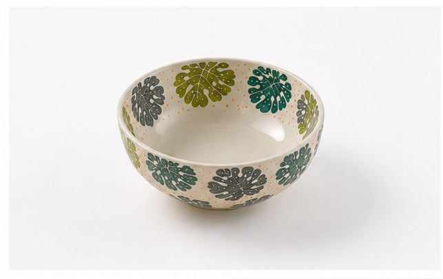 Set of ceramic bowls with green and gray pattern on a white background