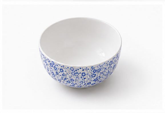 Set of blue floral-patterned ceramic dishes on a white background