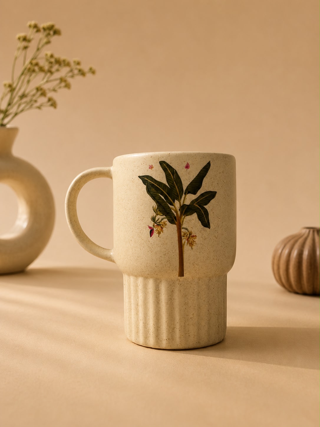 Ceramic mug with floral design on a beige background