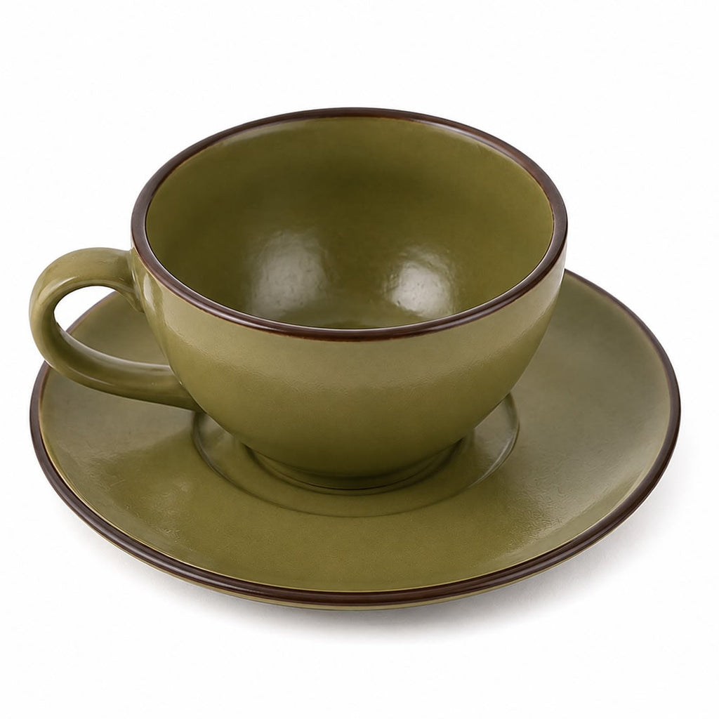 Green ceramic cup and saucer set on a white background