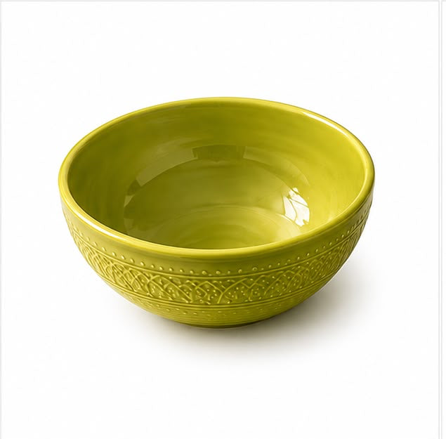 Set of green ceramic bowls and plates with decorative patterns on a white background